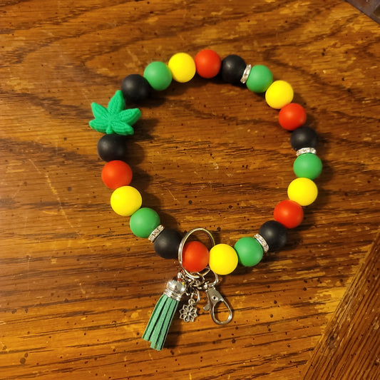 Black, Red, Yellow, and Green With Green Leaf Focal