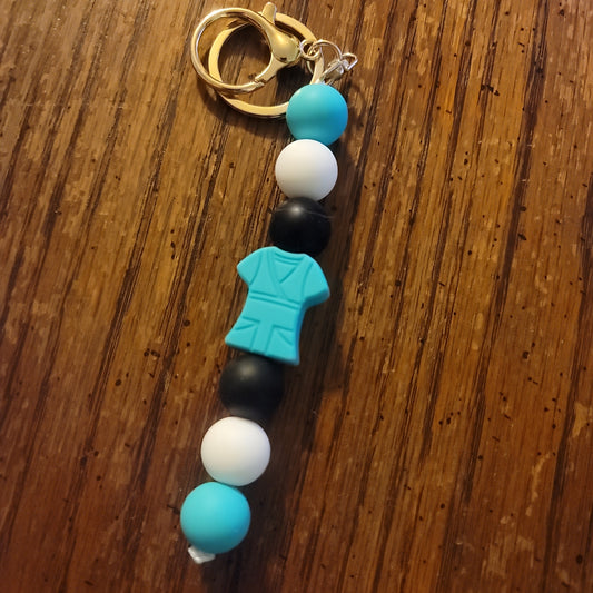 White,Black and Teal With Dark Teal Scrub Keychain