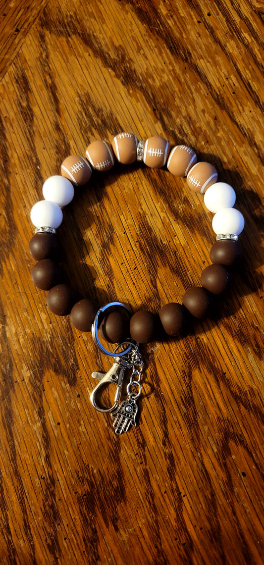 Brown and White Football Wristlet